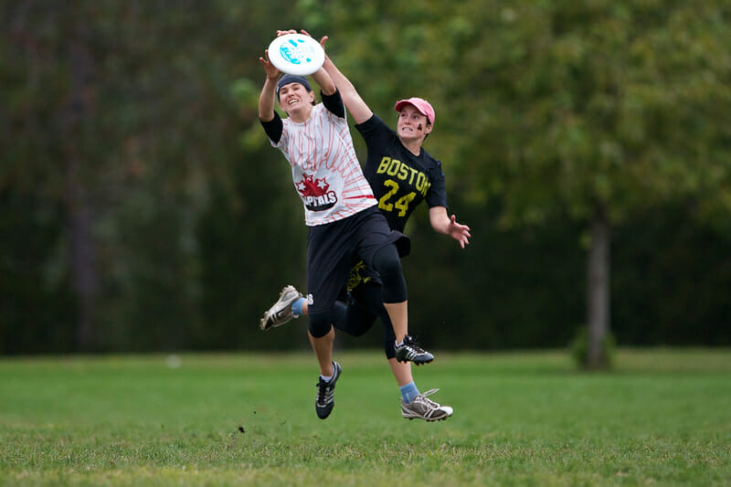 A Capitals player catches the disc with a Brute Squad defender in tight coverage in the Women's finals of Northeast Regionals.