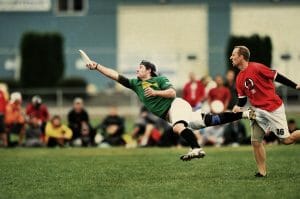 A Portland Rhino player lays out against Vancouver's Furious George.