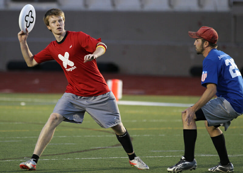 NexGen's Phillip Haas with the disc, playing against Boulder's Johnny Bravo.