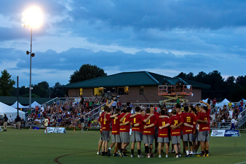 Revolver huddles up in front of the crowd at the 2013 US Open.