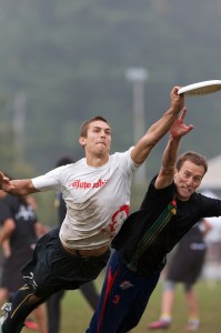 A lady of Slow White extends for a layout grab at Northeast Regionals