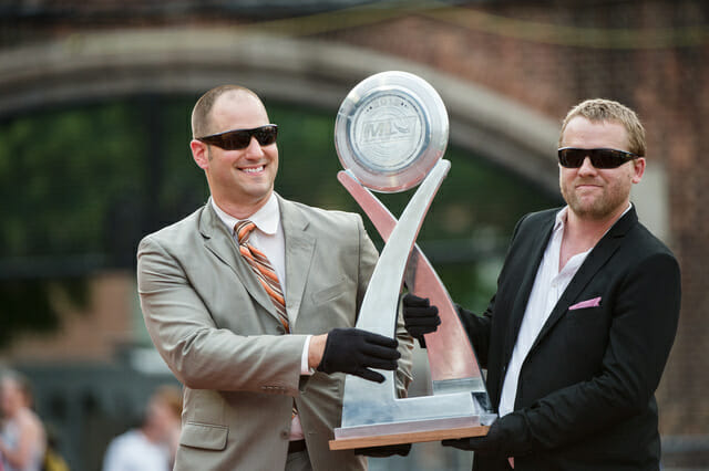 MLU Commissioner Jeff Snader (left) and Vice President Nic Darling present the 2013 MLU Championship trophy.