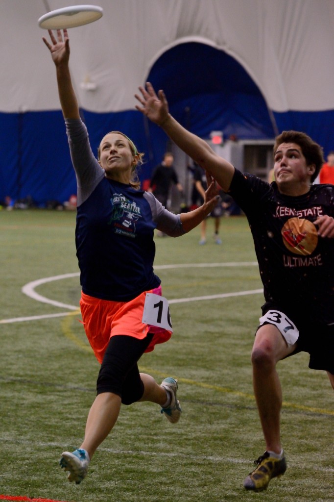 Emily Baecher reaches for a disc at the Boston Whitecaps combine.