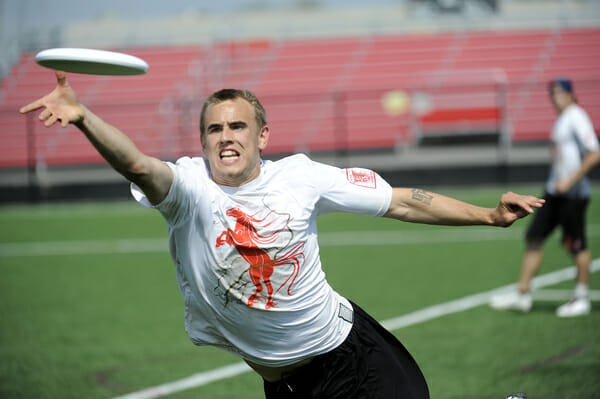 A Puget Sound Postmen player bids for a disc at the 2013 D-III College Championships.