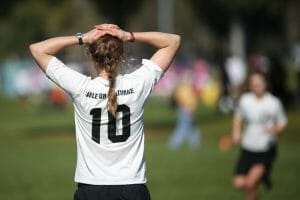 Lucia Childs-Walker looks on from Carleton's sideline at Stanford Invite