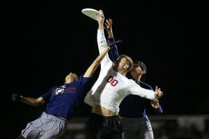 Machine's Jonathan "Goose" Helton skies for the score. Photo: Alex Fraser -- UltiPhotos.com