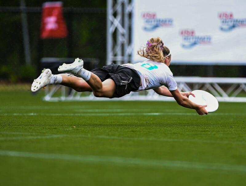 Claire Revere makes an diving grab in the endzone for Whitman. Photo: Brian Canniff -- UltiPhotos.com