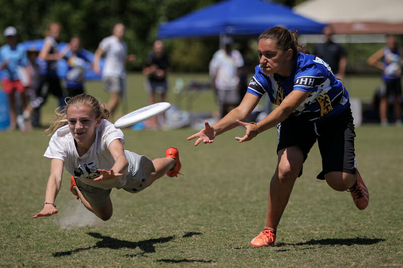 HB Woodlawn's Ella Juengst lays out for the D against Paideia. Photo: Christina Schmidt -- UltiPhotos.com