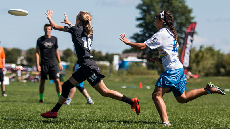 Swing Vote's Ella Juengt catches a goal out in front of a Bay Area defender in the YCC Mixed final. Photo: Daniel Thai -- UltiPhotos.com