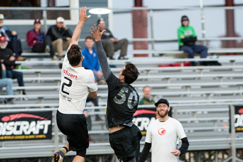 Nick Stuart (Sockeye #2) gets up over Beau Kittredge (Revolver #50) in the final round of Men’s Pool Play at the USA Ultimate Club National Championships. Photo: Jeff Bell -- UltiPhotos.com