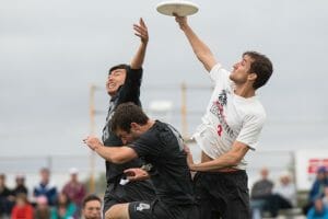 Kurt Gibson skies two Revolver defenders in the 2016 National title game. Photo: Jeff Bell - UltiPhotos.com