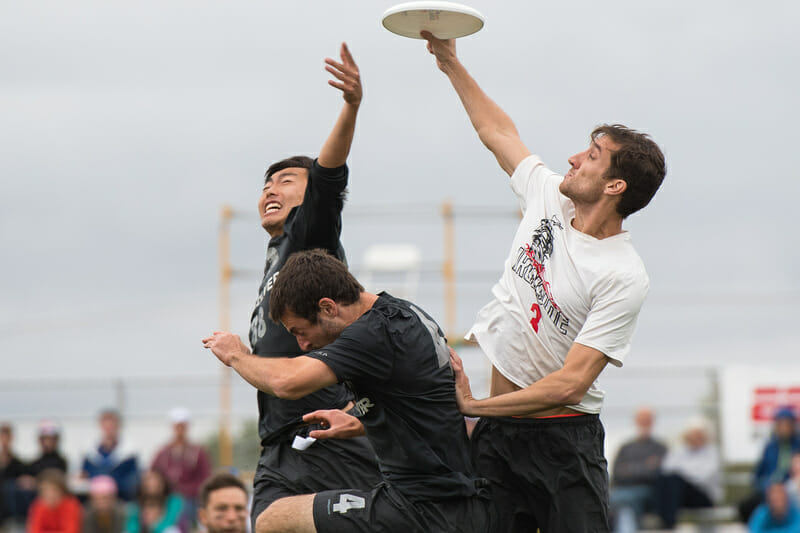 Ironside's Kurt Gibson skies for the grab over two Revolver defenders. Photo: Jeff Bell -- UltiPhotos.com