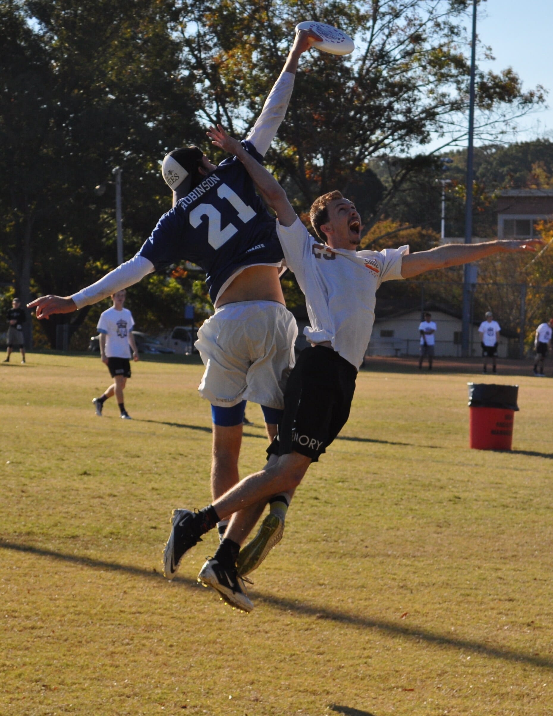 - Noah Robinson skies an Emory defender on Saturday. 