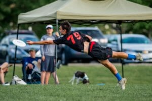 Pittsburgh's Mike Ing bids for a disc at the 2017 College Championships.