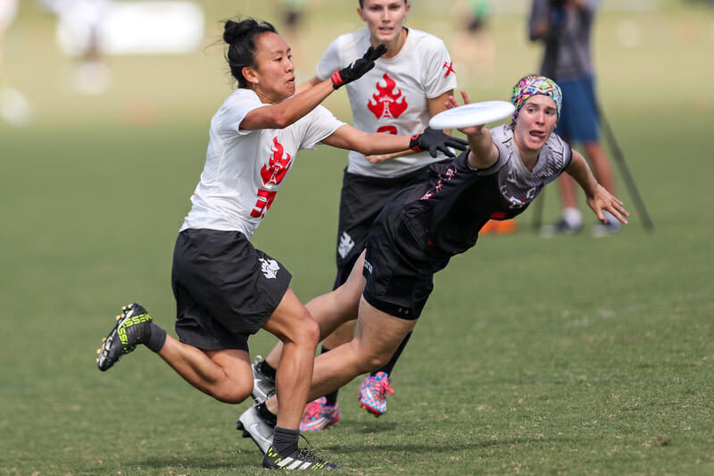 Ozone's Emily Lloyd gets a block against Riot in the 2017 Club Nationals quarterfinals.