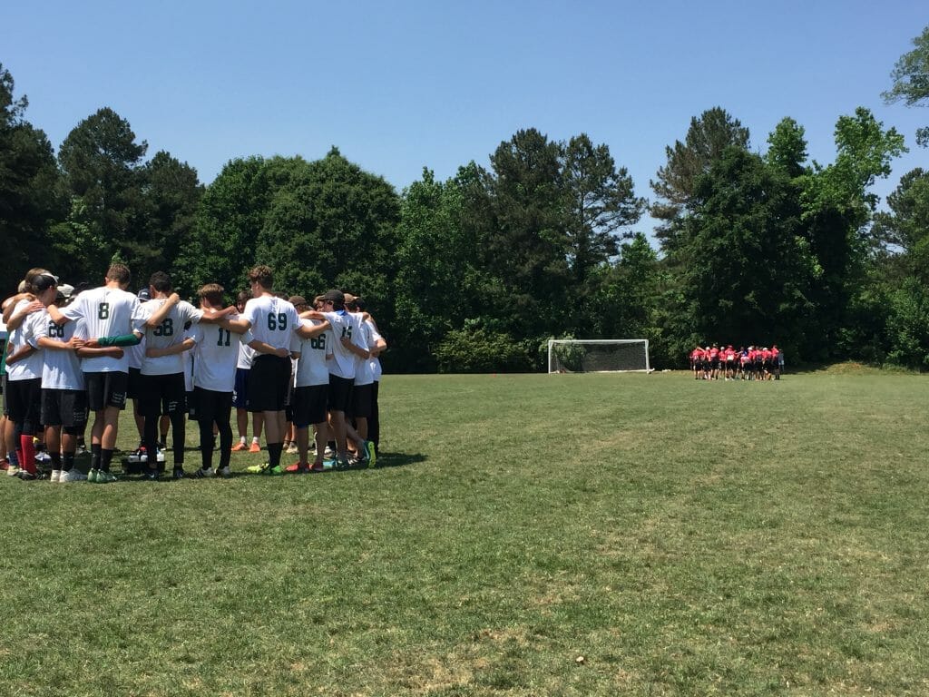 Carolina Friends and Center Grove huddle up during a timeout in the final moments of the final of Paideia Cup 2018.