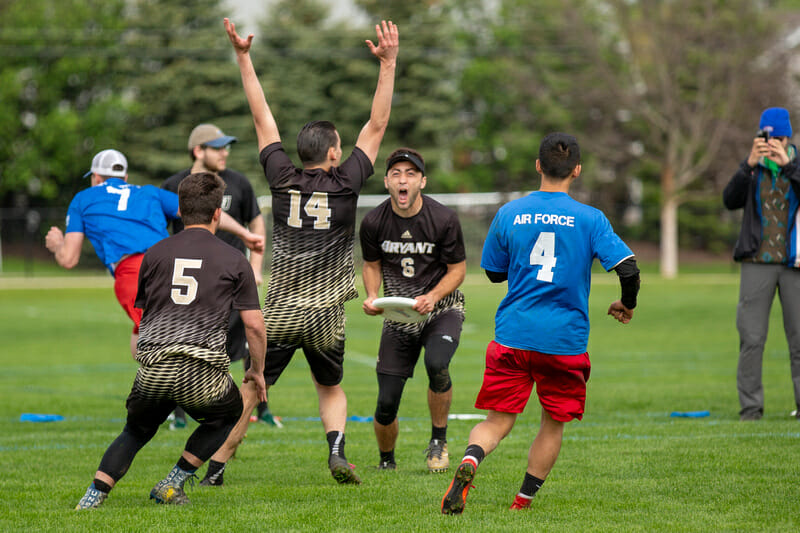 Bryant's Zach Tuxbury and his teammates celebrating the game winning goal of the 2018 D-III College Championship final. 