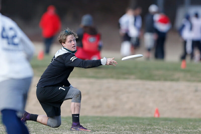 A Northwestern player throws a backhand at Queen City Tune Up 2018.