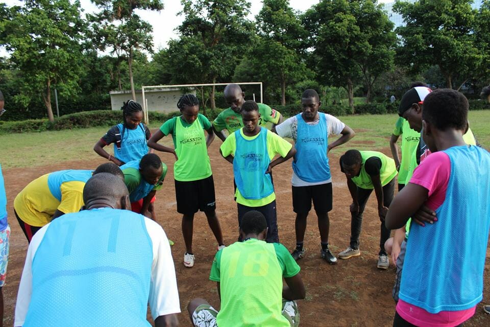 Kisumu Frisbee Club goes over tactics.