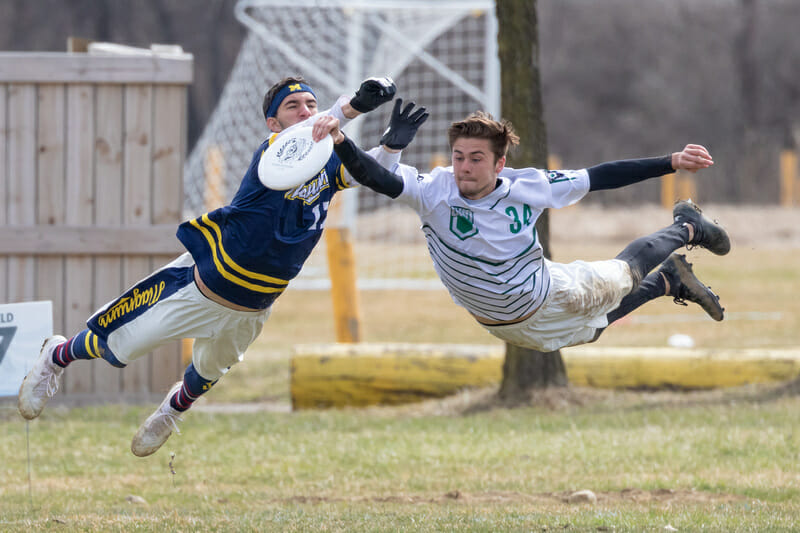 Ohio and Marquette players fly through the air at CWRUL Memorial 2019.