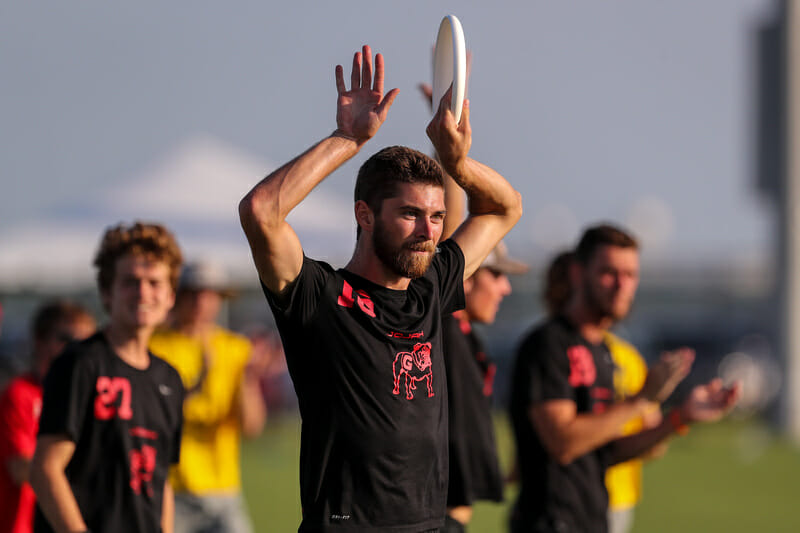Georgia's Hunter Cutts throws up the bookends symbol at the 2019 D-I College Championships.