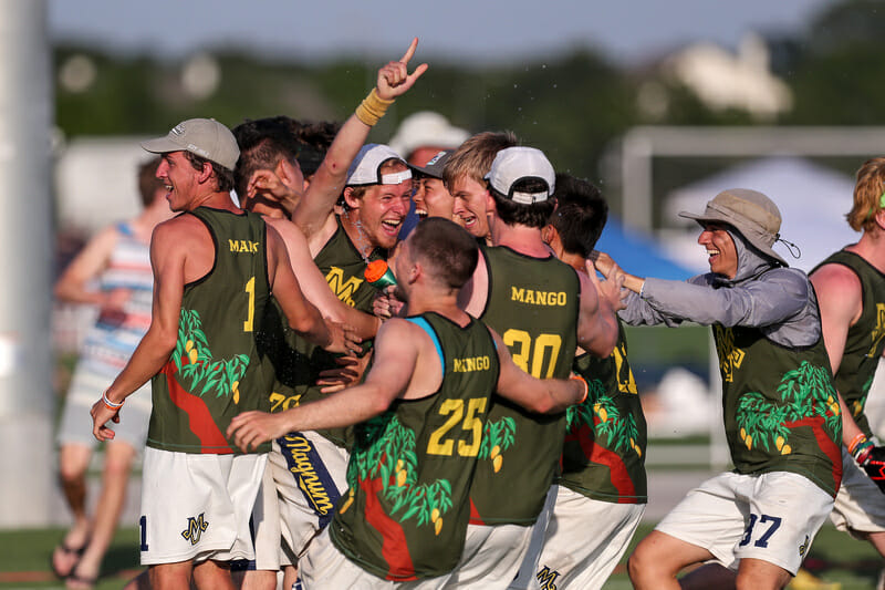 Michigan celebrates a quarterfinals berth at the 2019 College Championships.