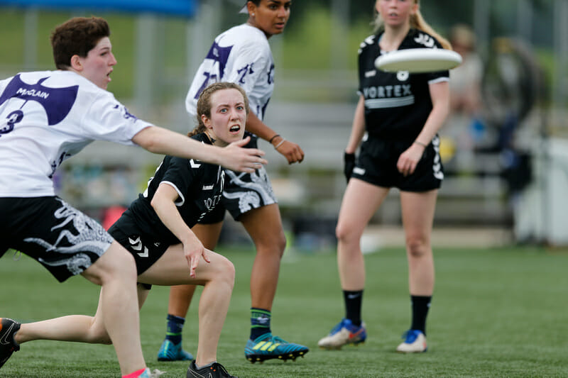 A St. Olaf player extends past the mark to make a throw at the 2019 D-III College Championships.