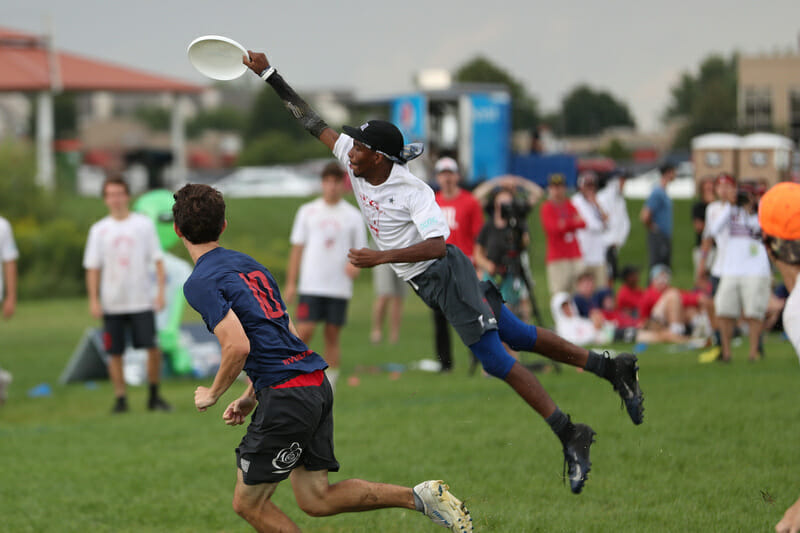 Justin Burnett makes the huge grab for ATLiens vs BUDA in the U20 Boys' truncated YCC final. Photo: Alec Zabrecky -- UltiPhotos.com