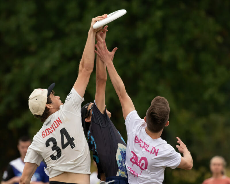 Three players challenge in the air for the disc at Force Freedom 2019. Photo: Kevin Wayner -- UltiPhotos.com