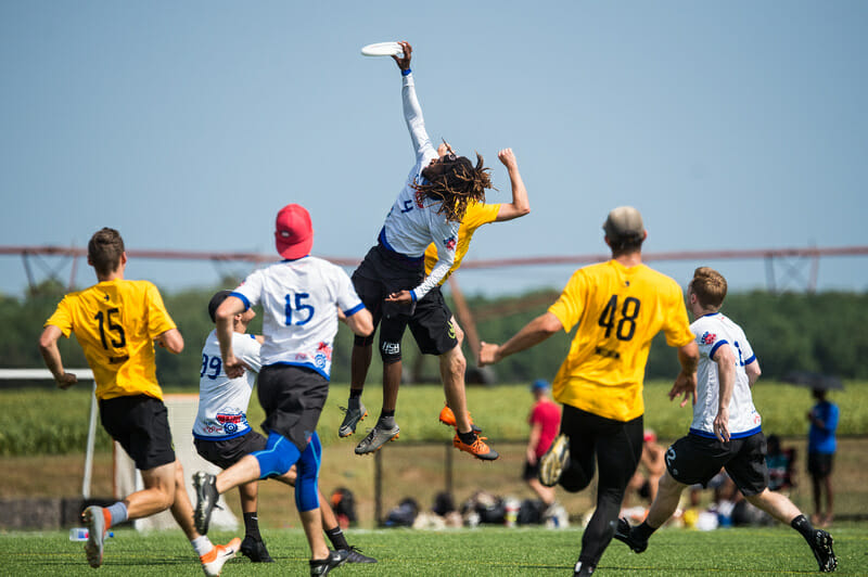 Washington DC Truck Stop's Delrico Johnson skies for the grab at 2019 Mid-Atlantic Club Regionals. Photo: Paul Andris -- UltiPhotos.com