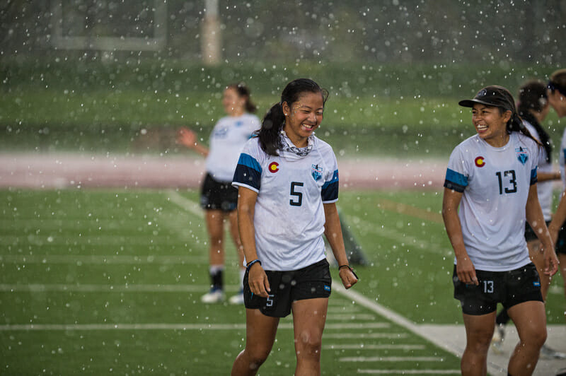 Despite the monsoon-like conditions during the women's final, it was all smiles for Denver Molly Brown's Nhi Nguyen and Alika Johnston at the 2019 Pro Championships. Photo: Paul Andris -- UltiPhotos.com
