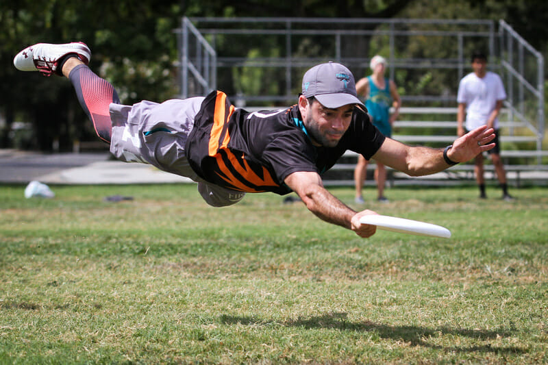 San Francisco Firefly's Simon Margolis makes the layout grab at 2019 Nor Cal Mixed Sectionals. Photo: Kristina Geddert -- UltiPhotos.com