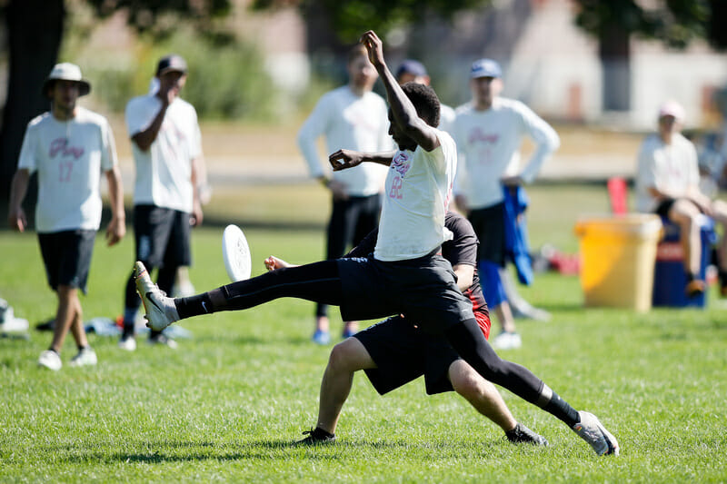 New York PoNY's Marques Brownlee perfectly times a foot block at 2019 Northeast Club Regionals. Photo: Burt Granofsky -- UltiPhotos.com