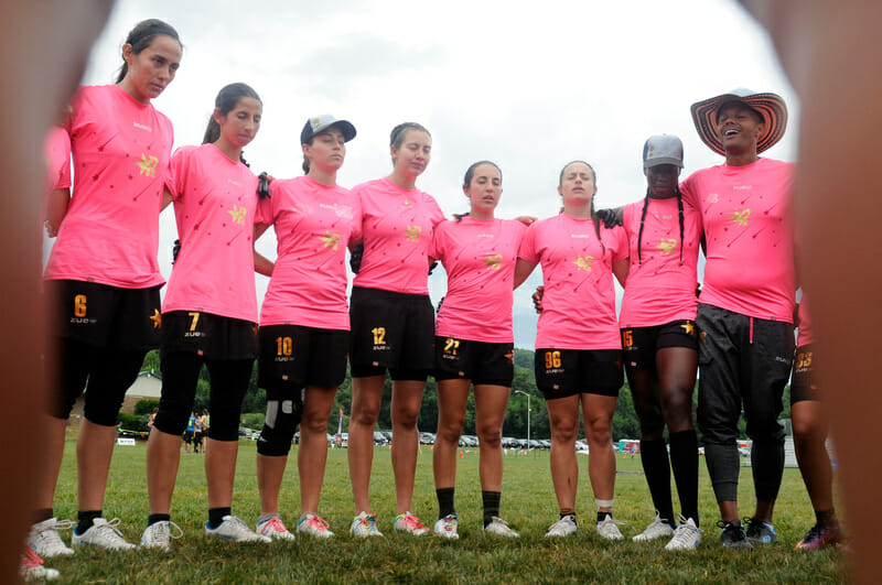 Medellin Revolution go through some visualization pracice before a game at WUCC 2018. Photo: Jolie J Lang -- UltiPhotos.com