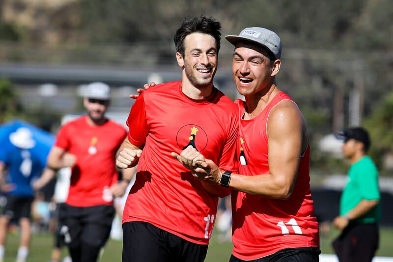 Mischief's Jacob Smith (left) is hugged by teammate Cody Kirkland (right) at the 2019 Club Championships. Photo: Kristina Geddert -- UltiPhotos.com