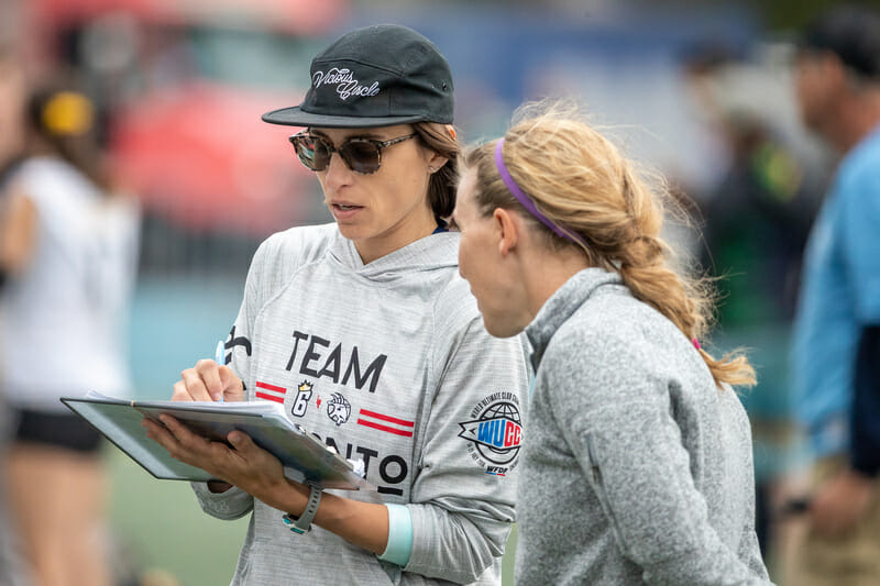 Toronto 6ixers coaches Carla DiFilippo and Alena Papayanis consult on the sideline during the 2019 Club Championships final. Photo: Rodney Chen -- UltiPhotos.com