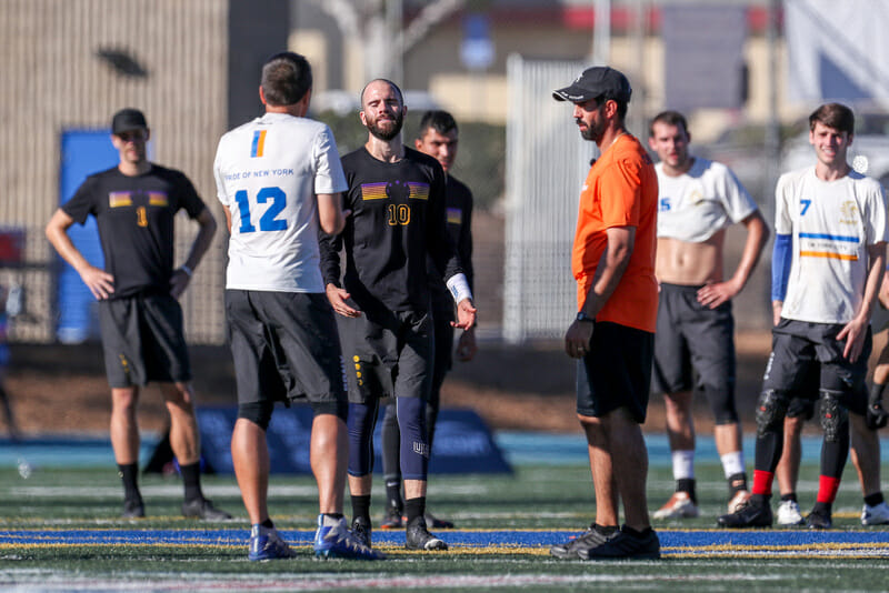 Revolver's Grant Lindsley, PoNY's Matt Lemar, and observer Jonathan Monforti discuss a controversial dangerous play call in the 2018 Club Championships Men's final. Photo: Paul Rutherford -- UltiPhotos.com