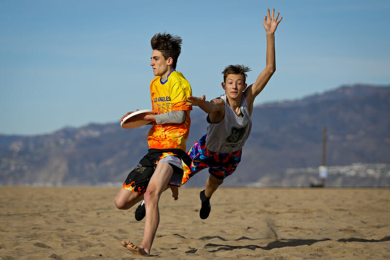 A close bid against a beautiful backdrop during U20 pool play at the Beach of Dreams event in Los Angeles. Photo: Kristina Geddert -- UltiPhotos.com