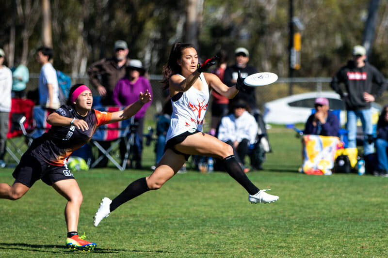 Stanford captain Maika Isogawa makes a catch in front of UCSB at the 2020 Presidents' Day Invite. Photo: Greg Pettus -- UltiPhotos.com