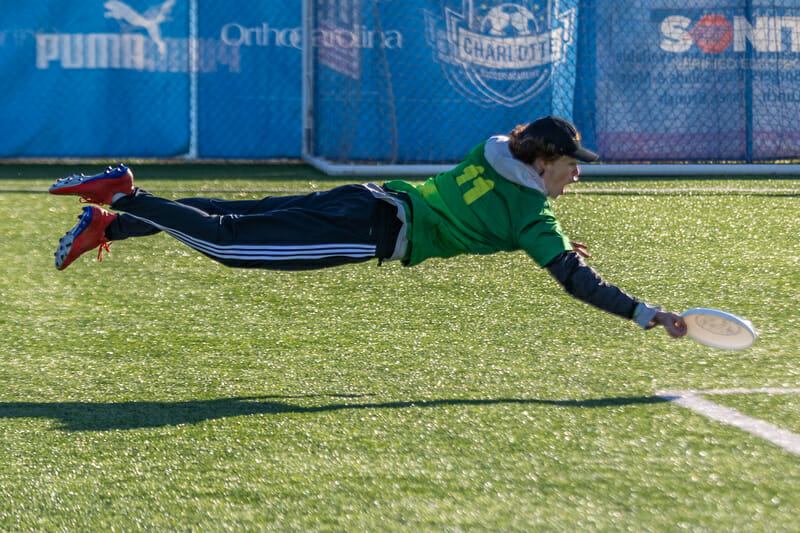 A players goes for a big horizontal bid in the Boys division at QCTU HS. Photo: Katie Cooper -- Ultihotos.com