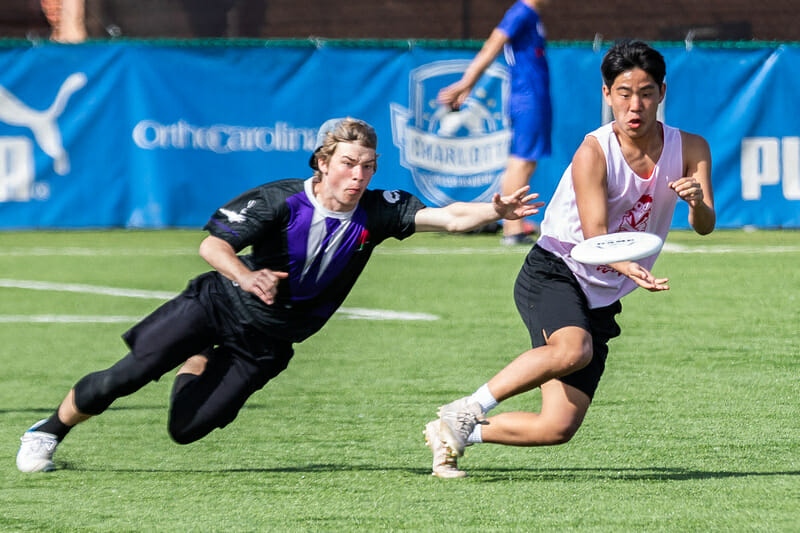 Boys action from Queen City tune Up High School. Photo: Katie Cooper -- UltiPhotos.com