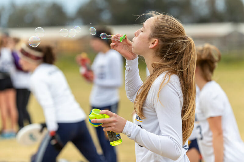 A Pie Queen blows bubbles on the Cal sideline at Stanford Invite 2020. Photo: Rodney Chen -- UltiPhotos.com