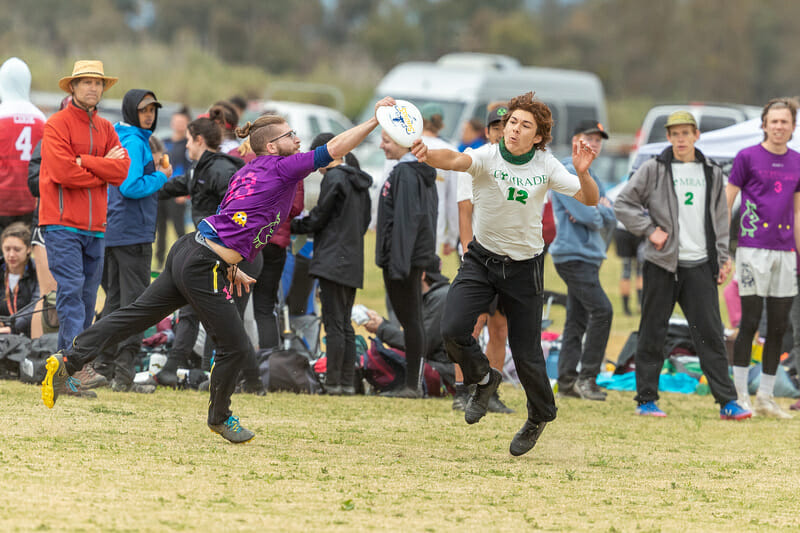 A Whitman player catches the disc just in front of Cal Poly SLO's Ed Ryon. Photo: Rodney Chen -- UltiPhotos.com