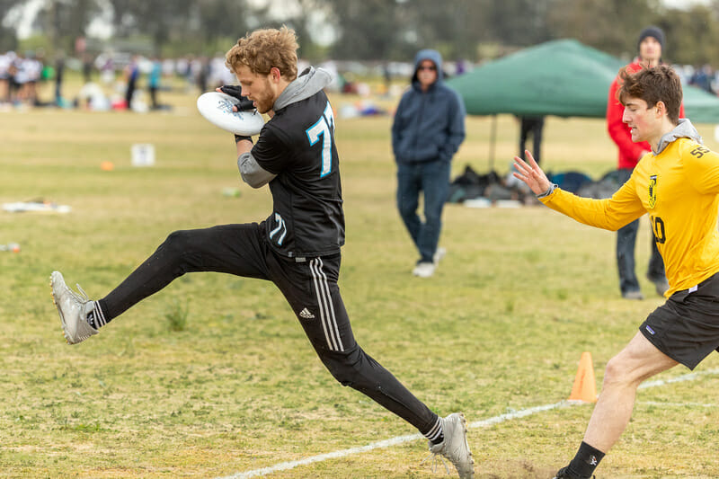 Tufts' Bryce Walsh spies the line as he toes in a catch at the 2020 Stanford Invite. Photo: Rodney Chen -- UltiPhotos.com