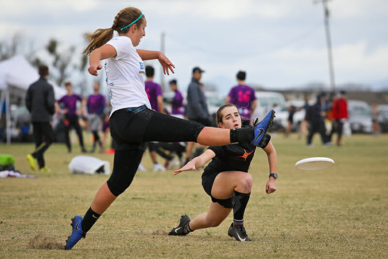 Carleton sneaks a throw under the attempted footblock by UCLA. Photo: Kristina Geddert -- UltiPhotos.com