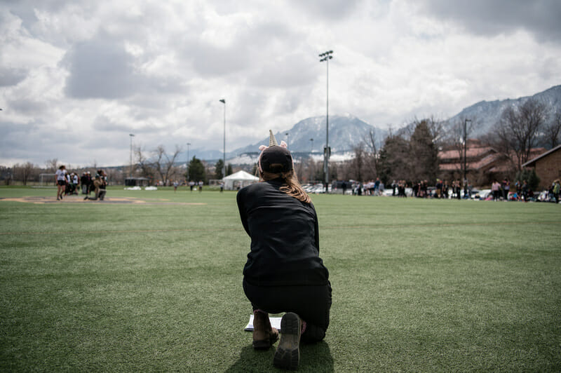 Colorado coach Claire Chastain surveys the field at the Rocky Mountain D-I Conference Championships in 2019. Photo credit: Sam Hotaling -- UltiPhotos.com