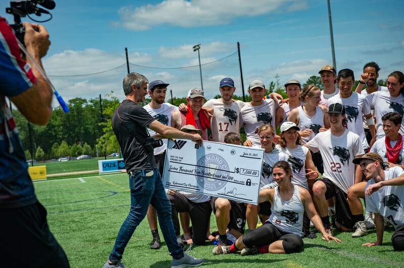 Todd Curran of XII Brands presents the first-place prize check to inaugural Richmond Cup champs Durham Toro. Photo credit: Kevin Leclaire — UltiPhotos.com