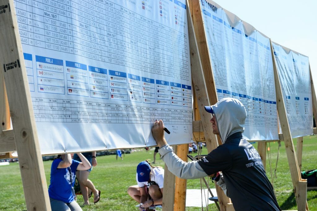 A volunteer updates scores at the 2018 World Ultimate Club Championships. Photo credit: Kevin Leclaire -- UltiPhotos.com