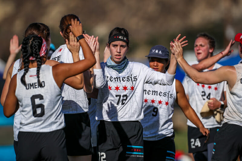 Nemesis' Jacqueline Jarik high fives her teammates at the 2019 USA Ultimate Club Championships.