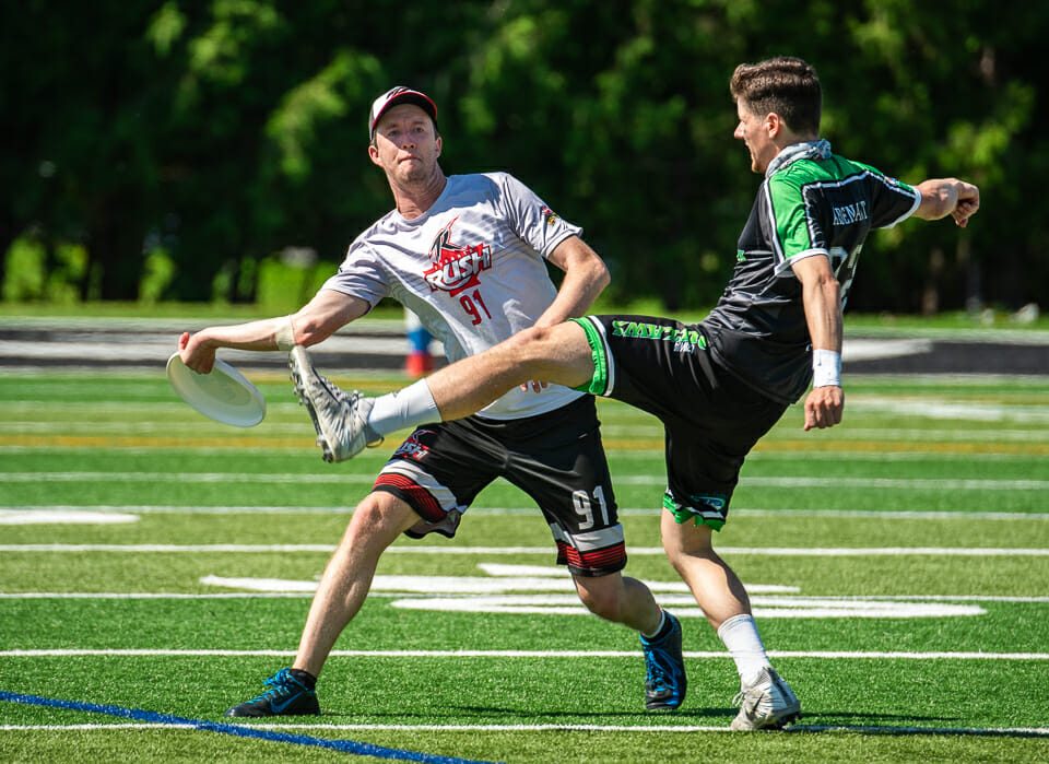Cam Harris of the Toronto Rush throws past Alec Arsenault of the Ottawa Outlaws. Photo: The AUDL